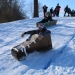 Sled racers representing SUNY Canton and Clarkson University go head to head in a speedy slide down the hill